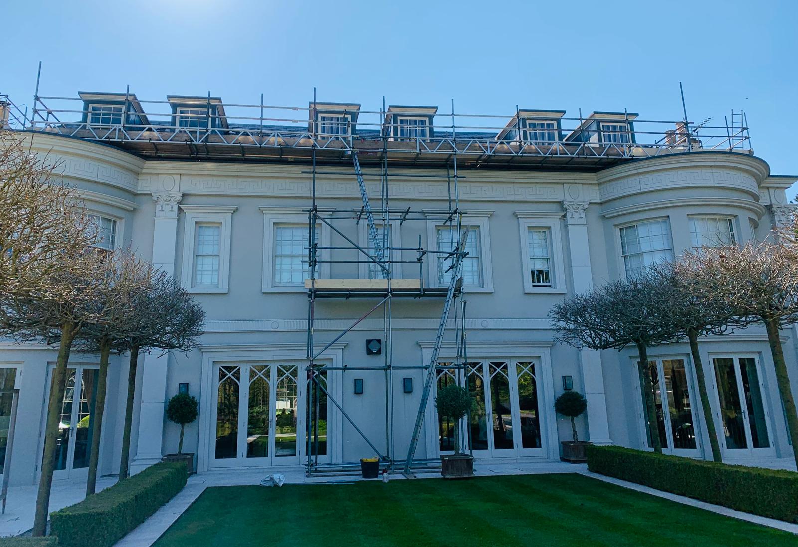 Period manor with full scaffold wrap